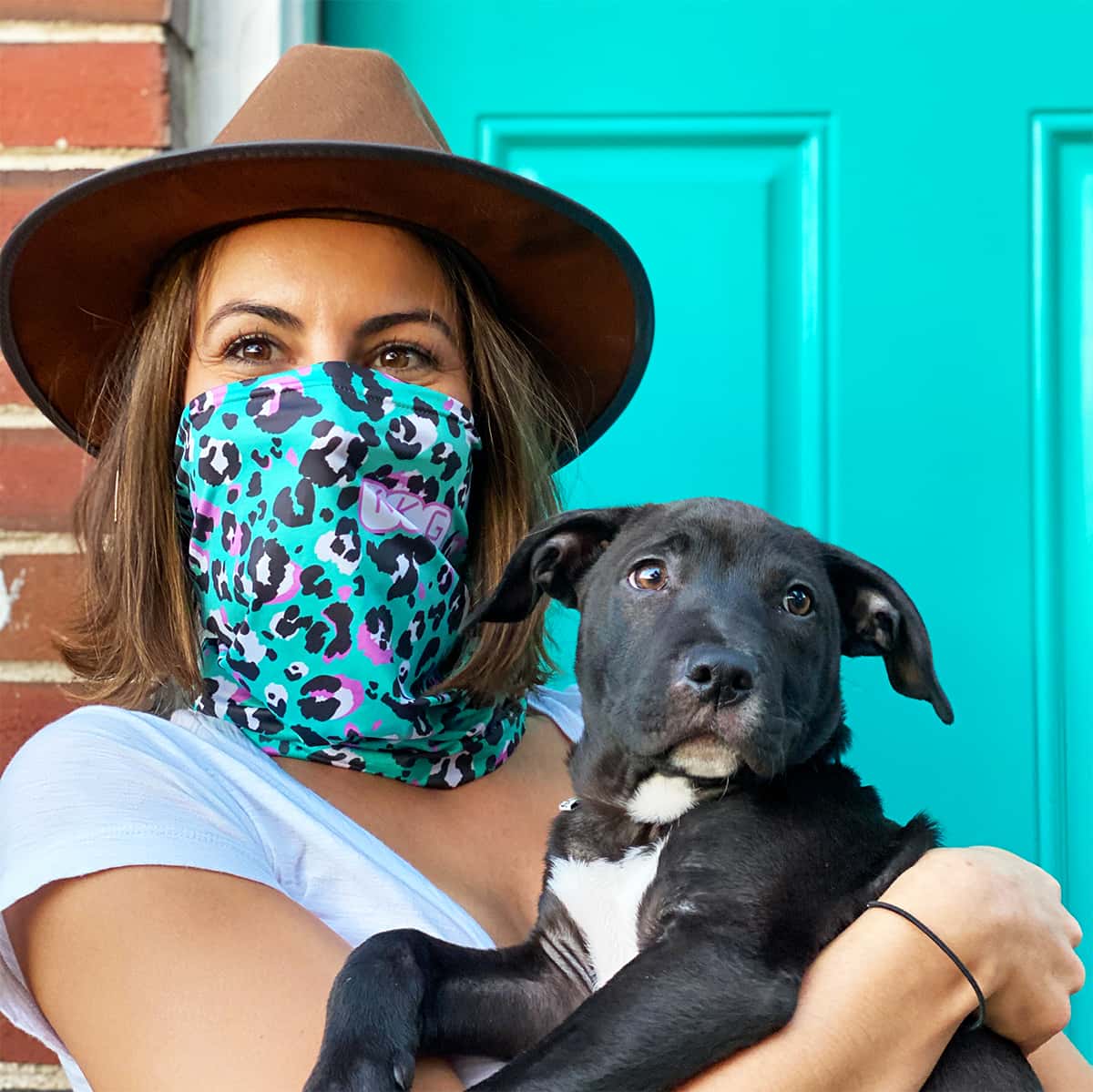 Woman Modeling A Lightweight Custom Neck Gaiter Holding a Dog