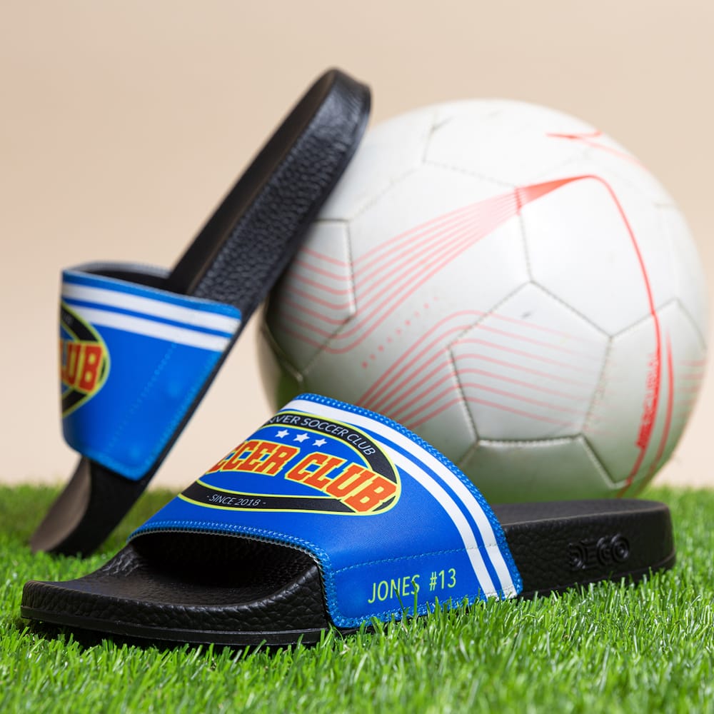 A soccer team wearing matching custom team slides
